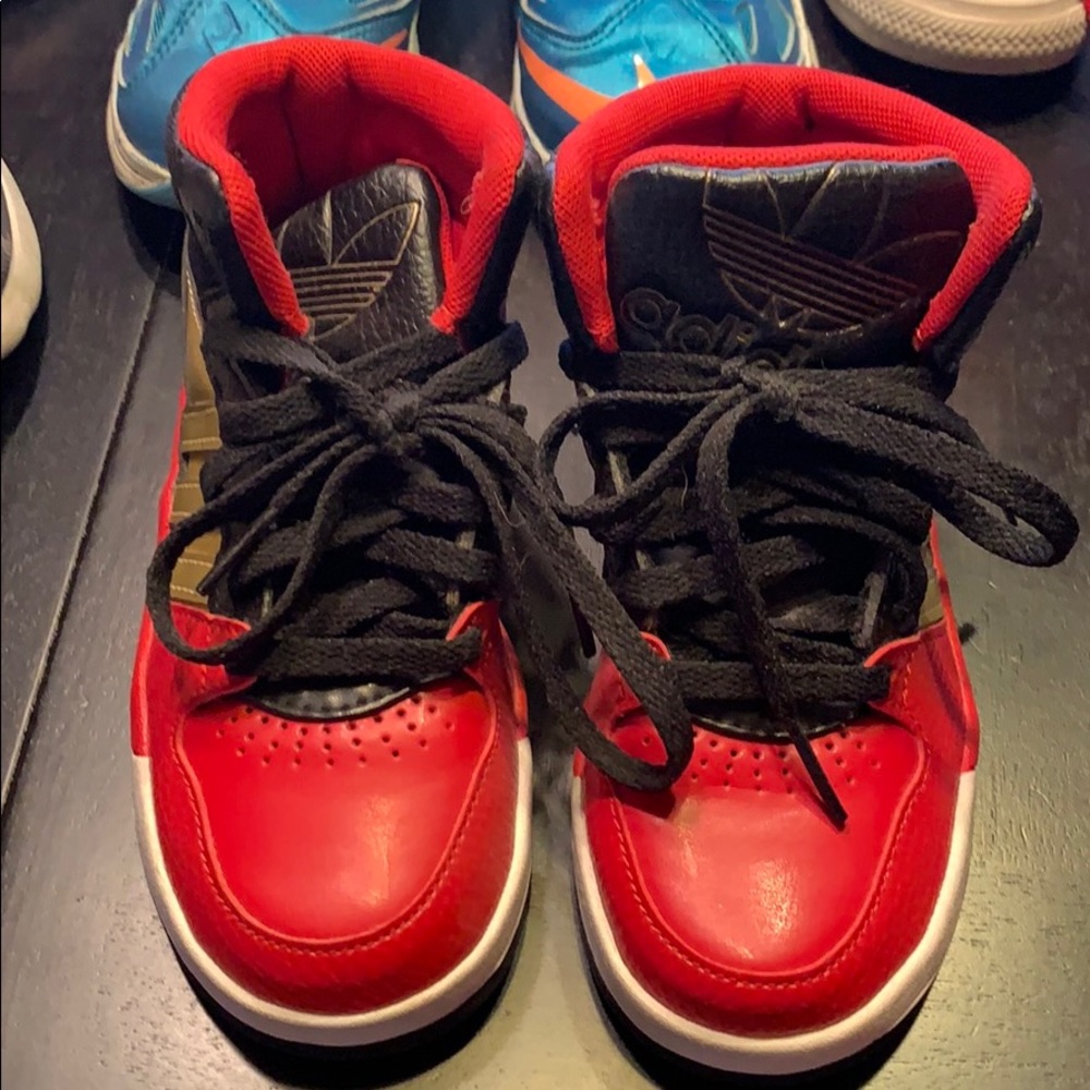 Adidas high top basketball shoes.